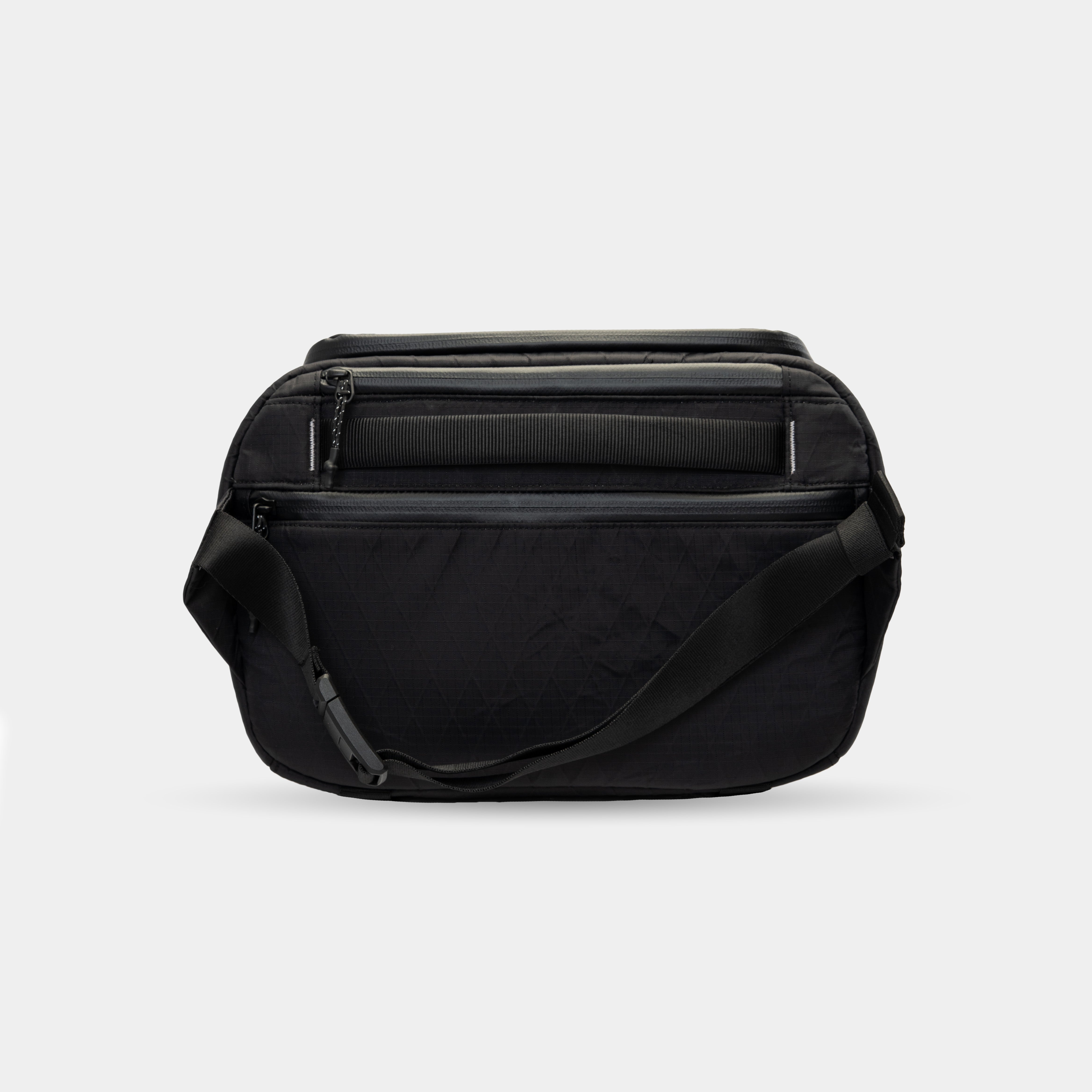 Black camera sling bag with internal and external pockets