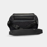 Weatherproof camera gear bag with padded strap and internal cushioning