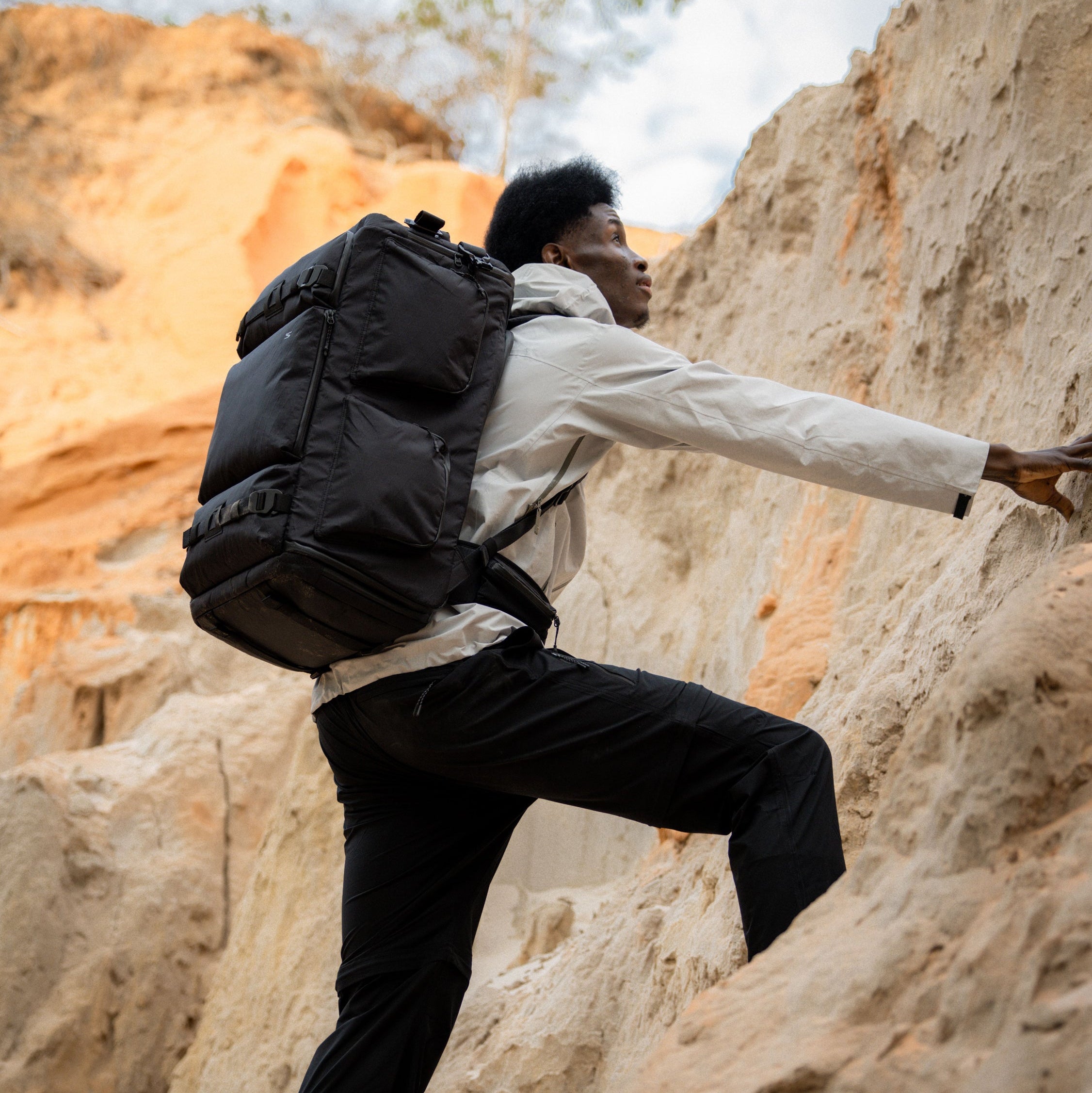 Camera backpack built for rough terrain—secure, balanced fit during climbing, perfect for mobile shoots and travel days.