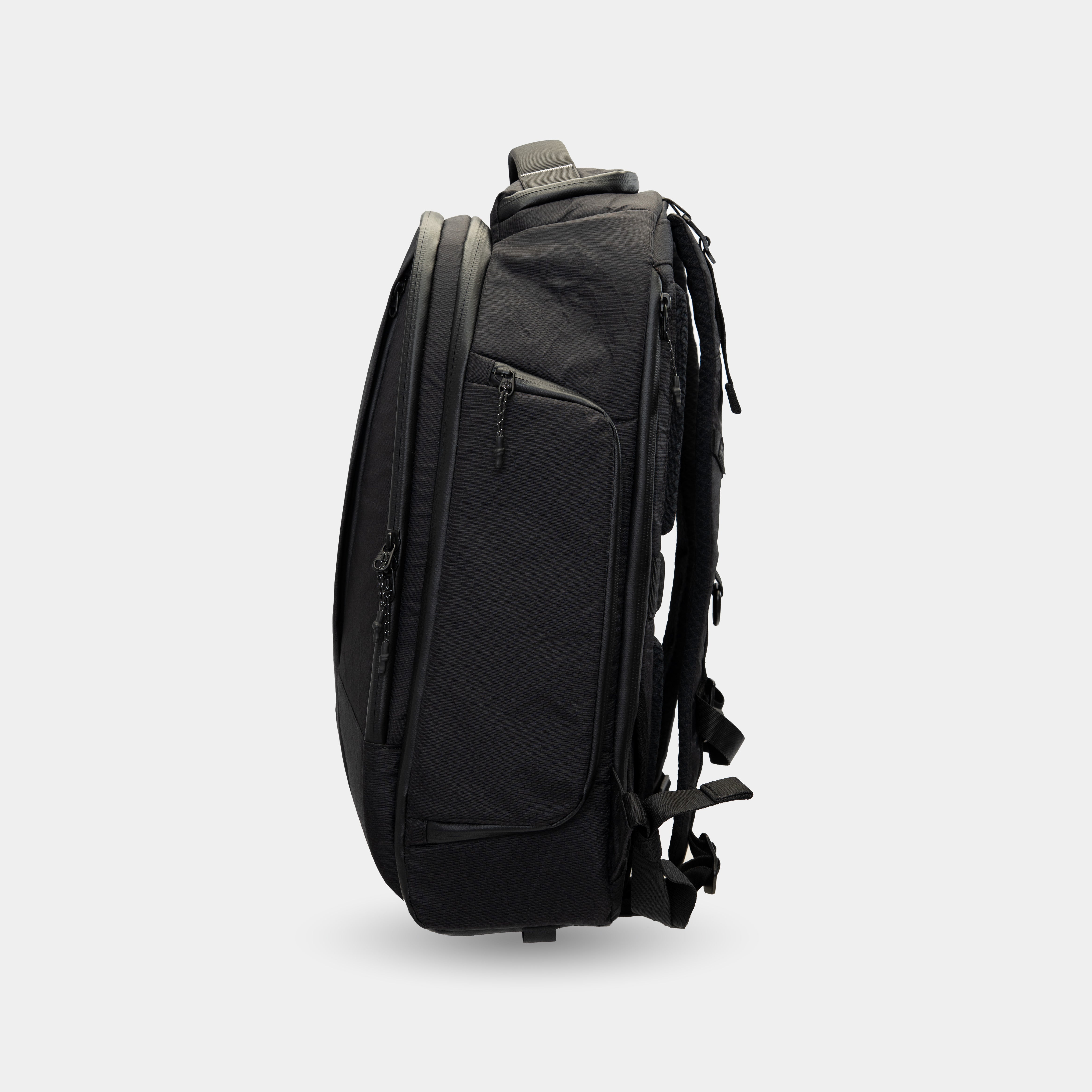 Close-up of adjustable side compression straps for load control backpack