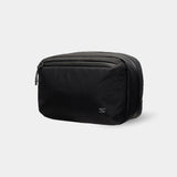 Waterproof tech sling with removable strap. Ideal for travel, commuting, or set days.